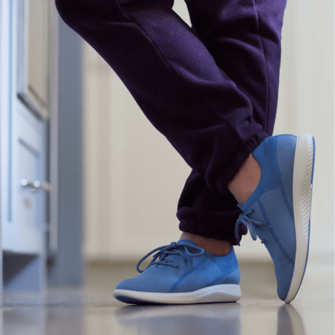 green reactives lifestyle imagery of a nurse wearing blue sneakers