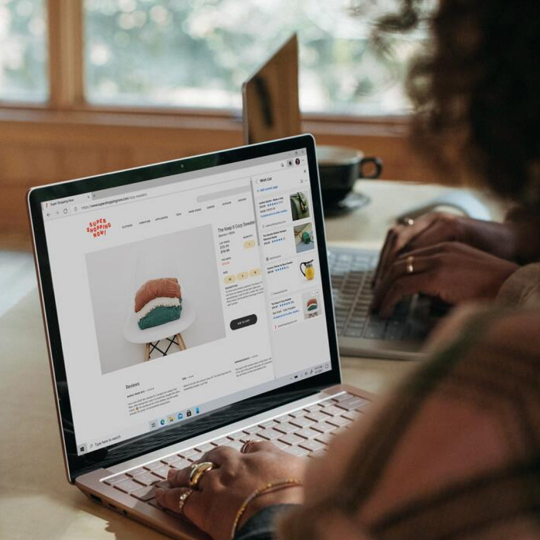 Female working at a computer looking at an online shop