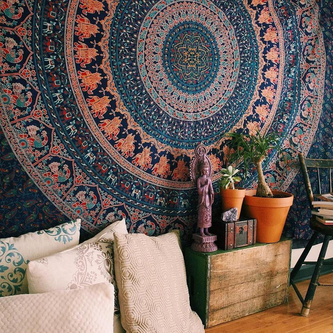 Bohemian tapestry hung on a wall in a comfortable room setting