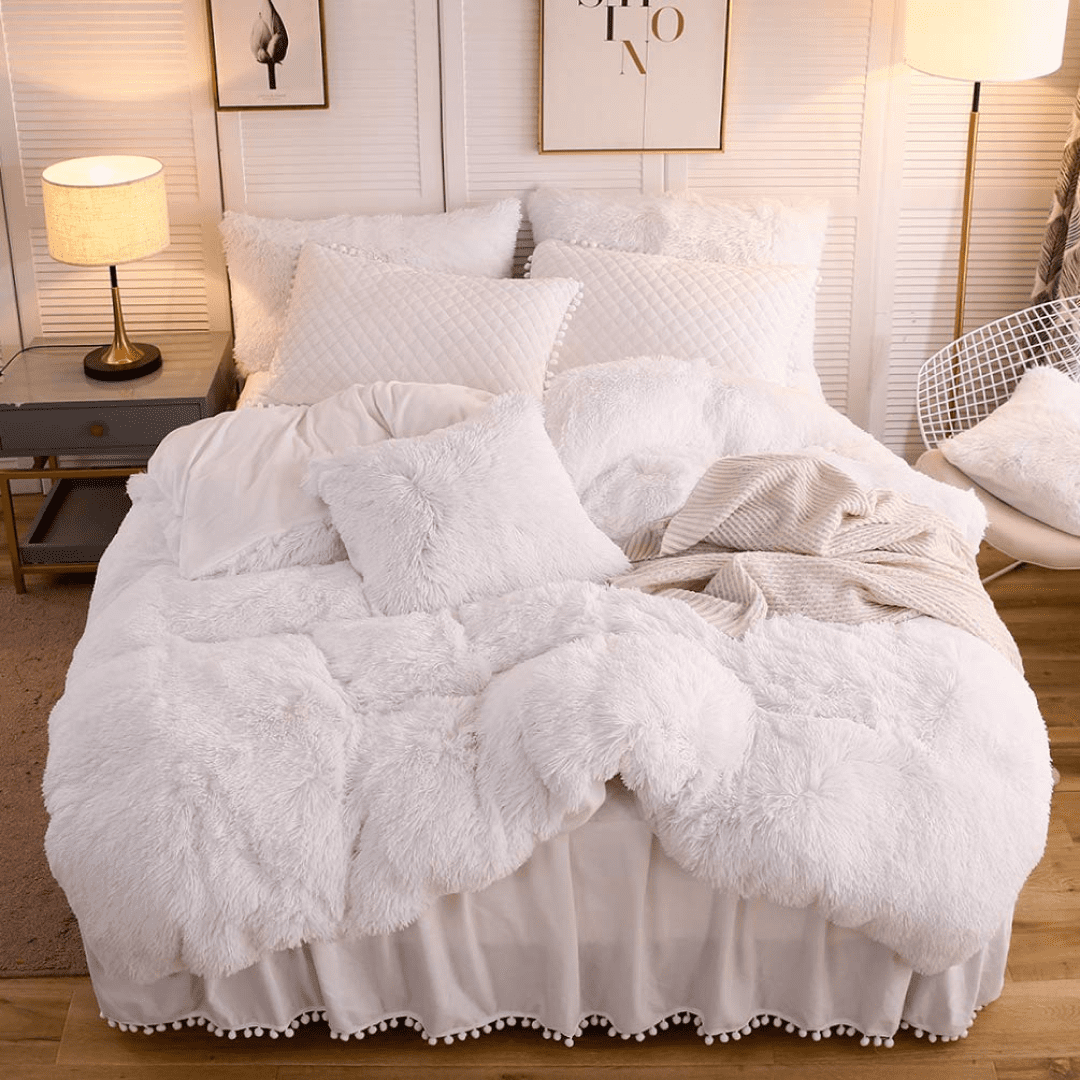 Bed made with big pillows and fluffy blanket from Tapestry Girls